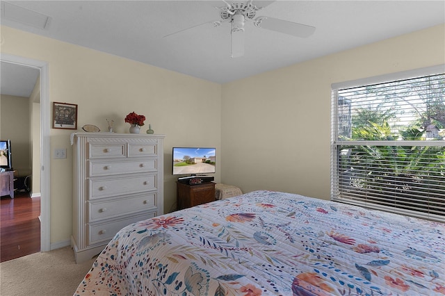 carpeted bedroom with ceiling fan