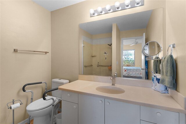 bathroom with vanity, an enclosed shower, and toilet