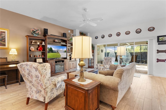 living room featuring ceiling fan and light wood-type flooring