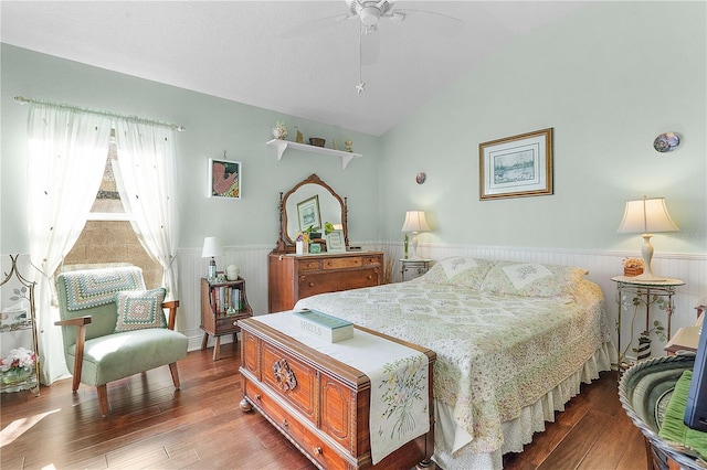 bedroom featuring hardwood / wood-style floors, ceiling fan, and lofted ceiling