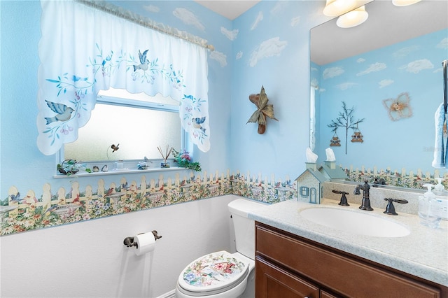 bathroom with vanity and toilet