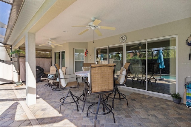 view of patio featuring ceiling fan