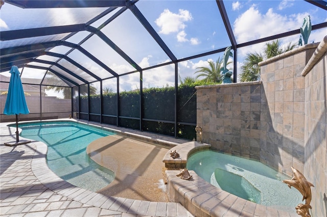 view of swimming pool featuring an in ground hot tub and glass enclosure