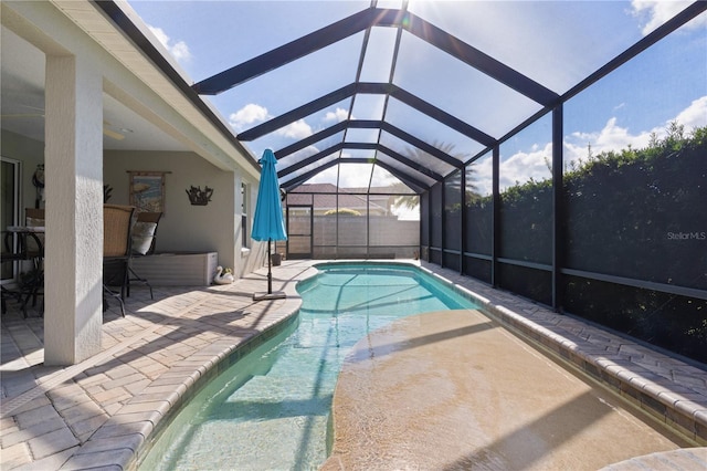 view of pool featuring a patio and a lanai