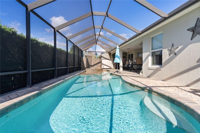 view of swimming pool featuring ceiling fan