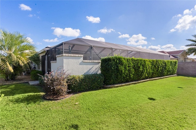 exterior space with a lawn and a lanai