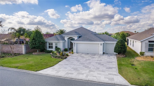 single story home with a garage and a front yard