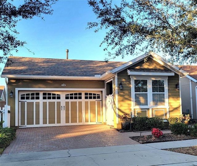 view of front of property with a garage