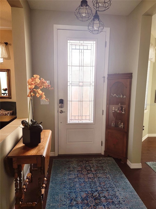 doorway to outside with dark wood-type flooring