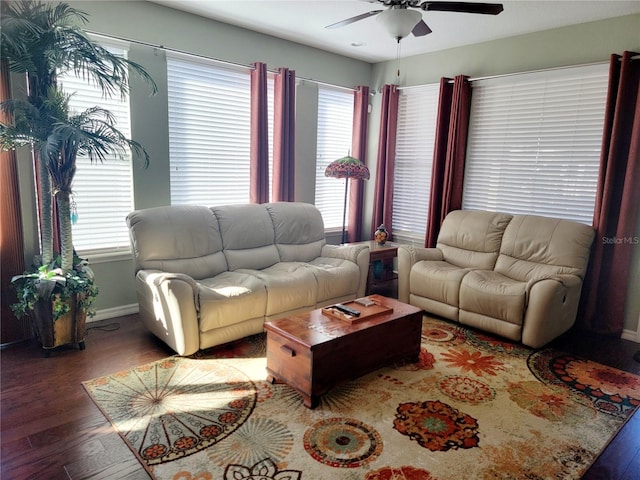 living room featuring dark hardwood / wood-style floors and ceiling fan