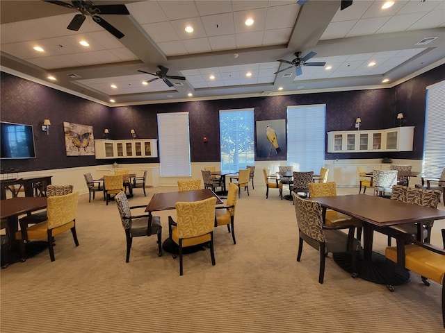 dining area featuring light carpet, beamed ceiling, and coffered ceiling