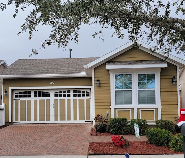 view of front of property with a garage