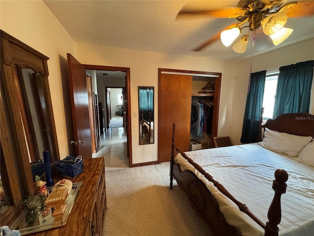 carpeted bedroom with a closet and ceiling fan