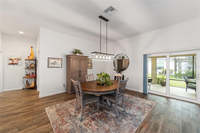 dining area featuring dark hardwood / wood-style flooring