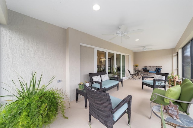 view of patio with ceiling fan and an outdoor hangout area