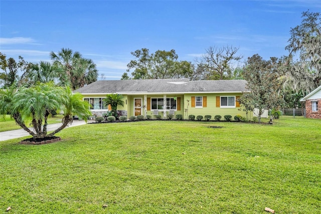 ranch-style home with a front lawn