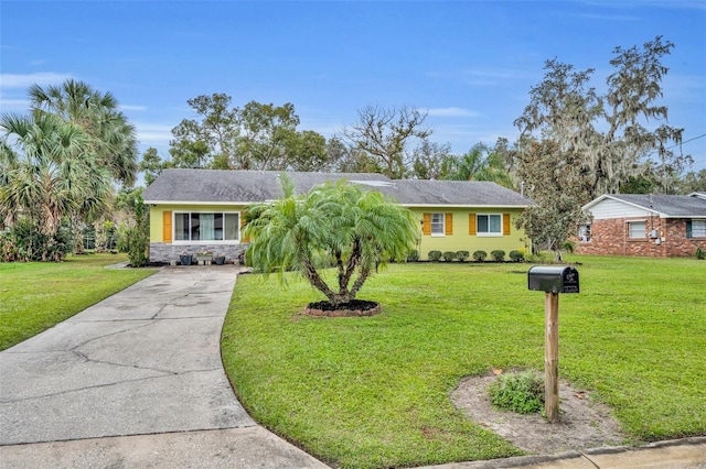 ranch-style house with a front lawn