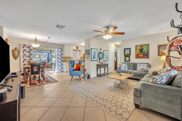 tiled living room featuring ceiling fan