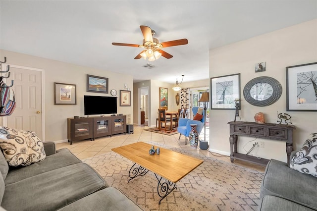 tiled living room with ceiling fan