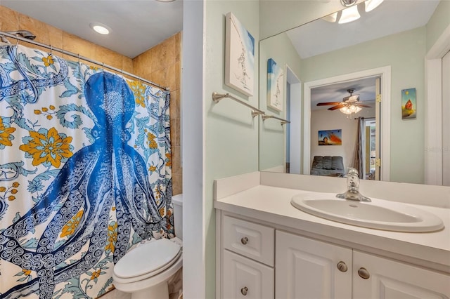 bathroom with walk in shower, vanity, toilet, and ceiling fan