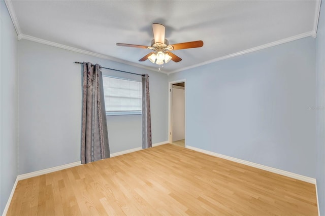 empty room featuring ceiling fan, ornamental molding, and hardwood / wood-style flooring