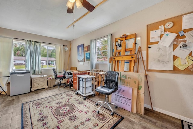 office area featuring ceiling fan and light hardwood / wood-style flooring