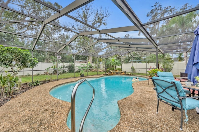 view of pool with a lanai and a patio area