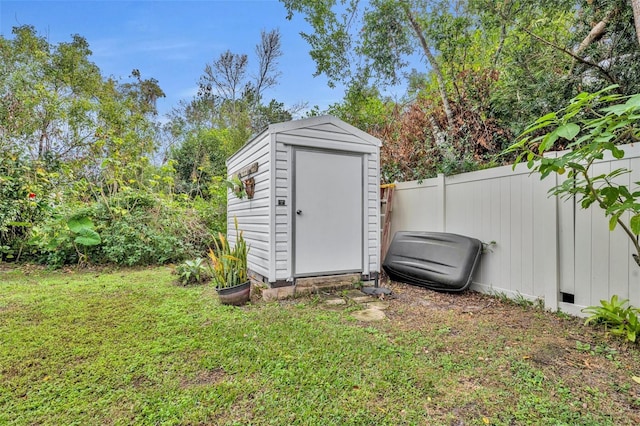 view of outbuilding featuring a yard