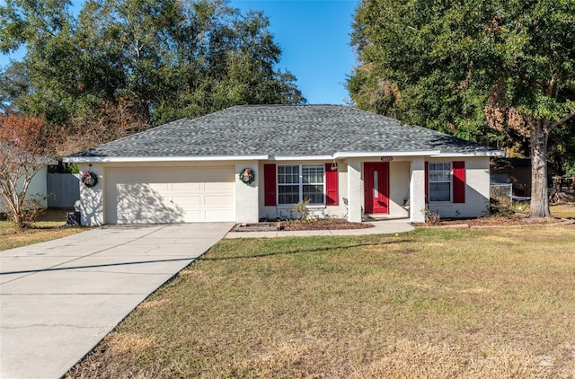 ranch-style house featuring a garage and a front lawn