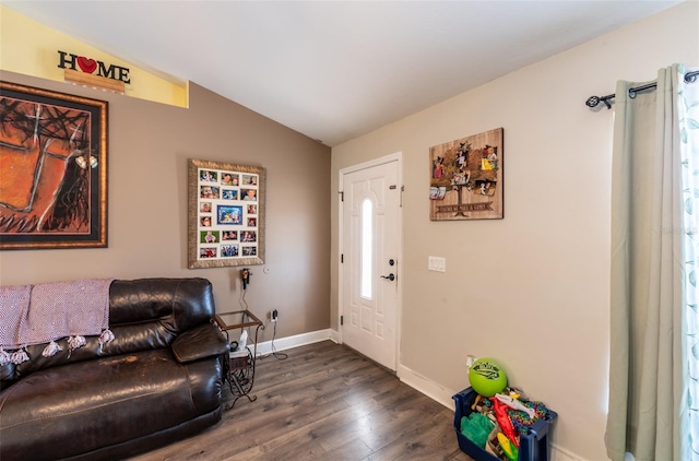 living room featuring dark wood-type flooring and vaulted ceiling