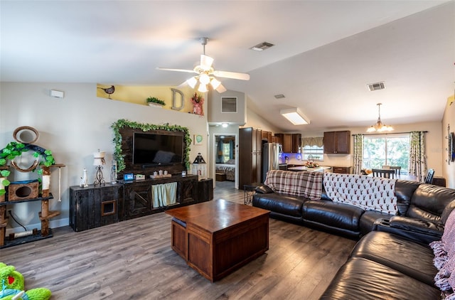 living room with hardwood / wood-style floors, ceiling fan with notable chandelier, and lofted ceiling