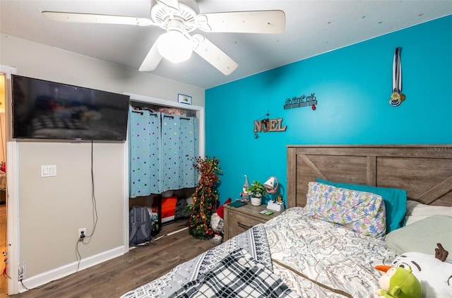 bedroom with dark hardwood / wood-style flooring and ceiling fan