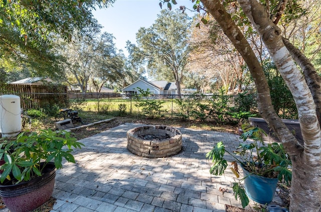 view of patio / terrace featuring an outdoor fire pit