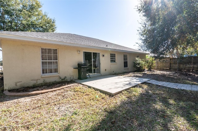 rear view of house with a patio