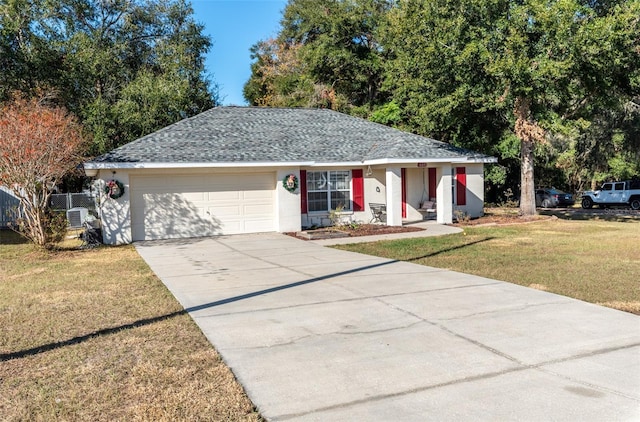 ranch-style house with a front yard, central AC, and a garage