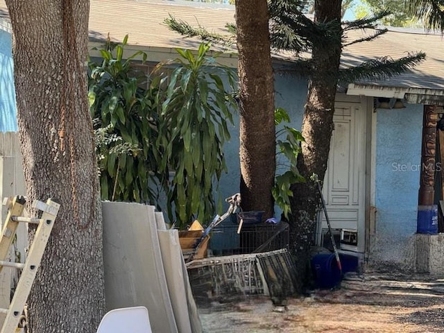 view of side of property with stucco siding