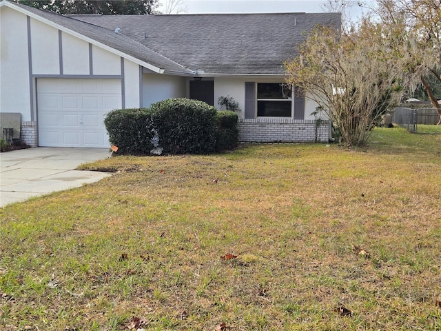 view of home's exterior featuring a yard and a garage