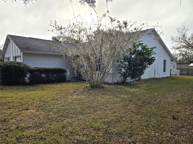 view of home's exterior with a lawn