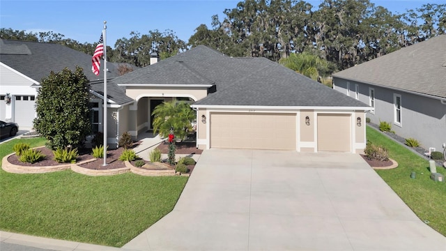 view of front of home featuring a garage and a front lawn