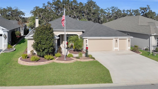 view of front of house with a front yard and a garage