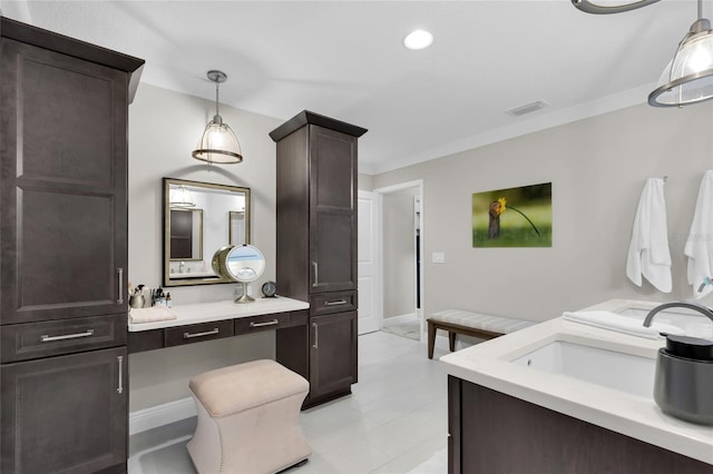 bathroom featuring sink and crown molding