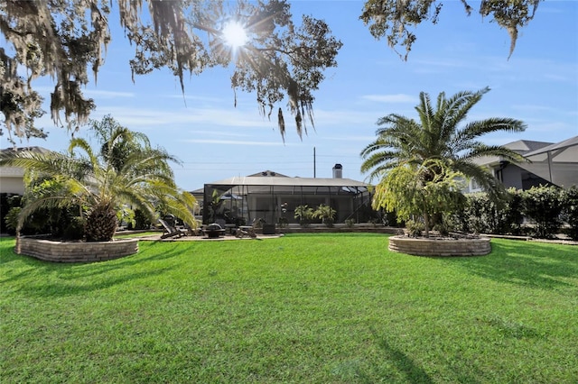 view of yard with a lanai