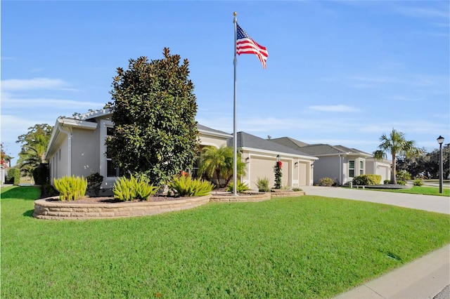 ranch-style home with a front yard and a garage