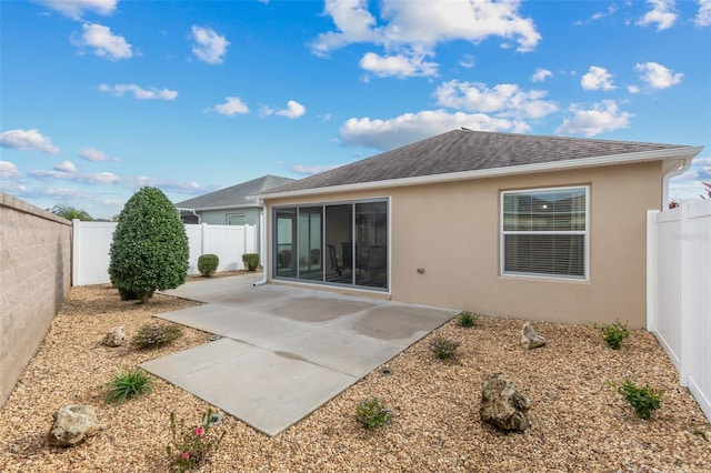 rear view of house with a patio area