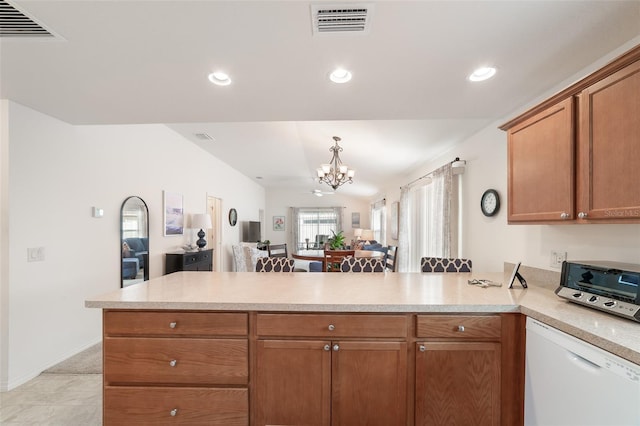 kitchen featuring dishwasher, kitchen peninsula, light tile patterned floors, and a chandelier