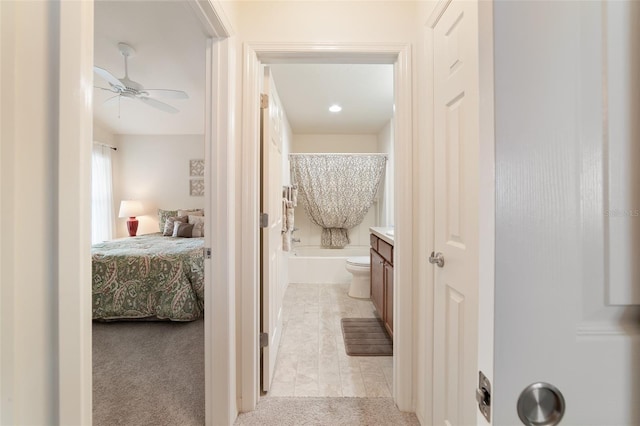 corridor with light colored carpet