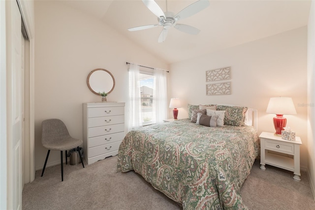 carpeted bedroom featuring a closet, ceiling fan, and lofted ceiling