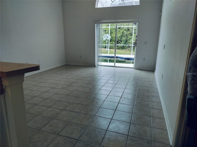 unfurnished living room featuring tile patterned flooring