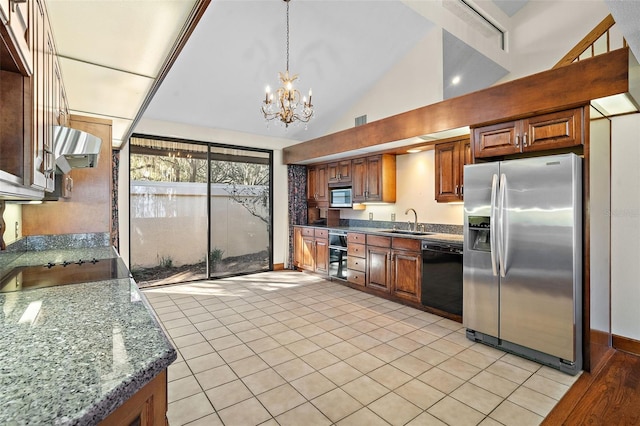 kitchen with sink, a notable chandelier, dark stone counters, decorative light fixtures, and black appliances