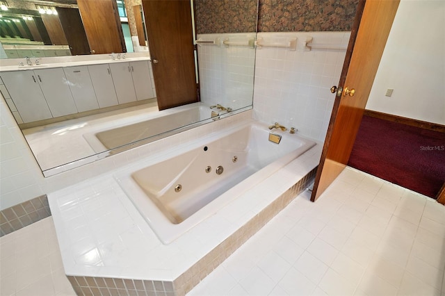 bathroom featuring vanity and a relaxing tiled tub